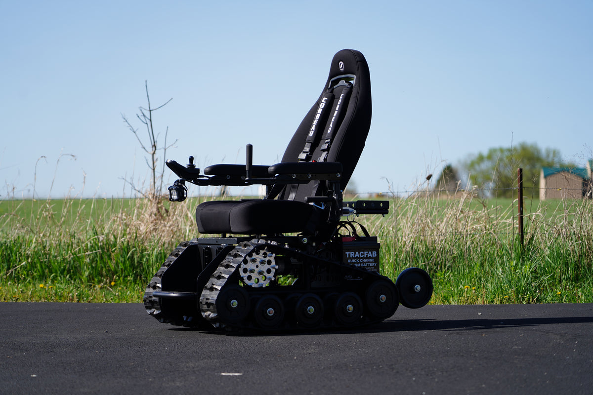TracFab tracked wheelchair outdoors.