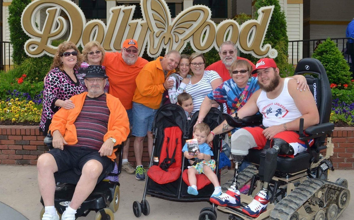 A family posing together at Dollywood with a TracFab rider.